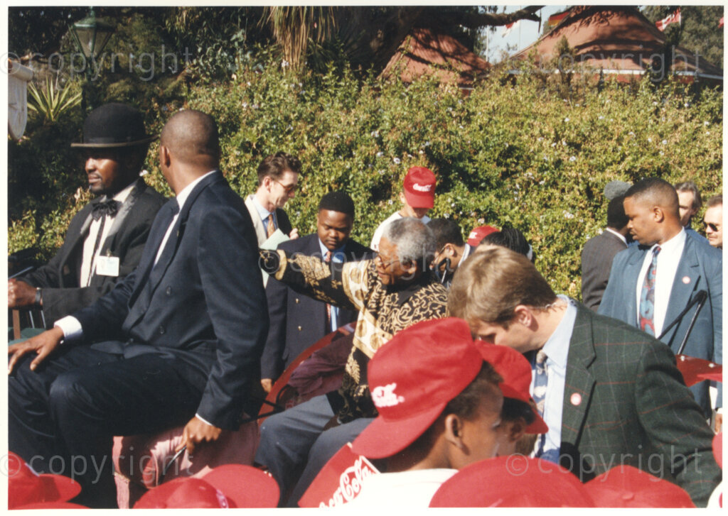 Gold Reef City, Johannesburg, Gauteng, South Africa, 19950717. PHOTO: ANC Archives.

The President of South Africa, Nelson Mandela, arrives at his 77th birthday celebration at Gold Reef City, Johannesburg, in a horse-drawn carriage. More than 2,000 underprivileged children, including 34 children who are currently imprisoned, street children, children from orphanages, mentally disabled children and children who have been abused, have been invited to attend his birthday celebration on Monday the 17th July 1995. Nelson Mandela is attending this function in his personal capacity as he places special emphasis on the plight of children.