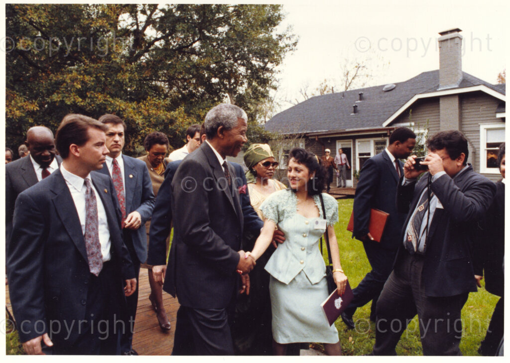 Rothko Chapel, Houston, Texas, United States of America, 19911208. PHOTO: ANC Archives.

Nelson Mandela holding the hand of Maria Mirtala Lopez (centre) from San Salvador at the Rothko Chapel, Houston, Texas, the United States of America (USA) on 8 December 1991 when Mandela delivered the keynote address at the twentieth anniversary of the Rothko Chapel awards and received the Carter-Menil Human Rights Prize which recognizes individuals and organizations who, at great risk, denounce violations of human rights.