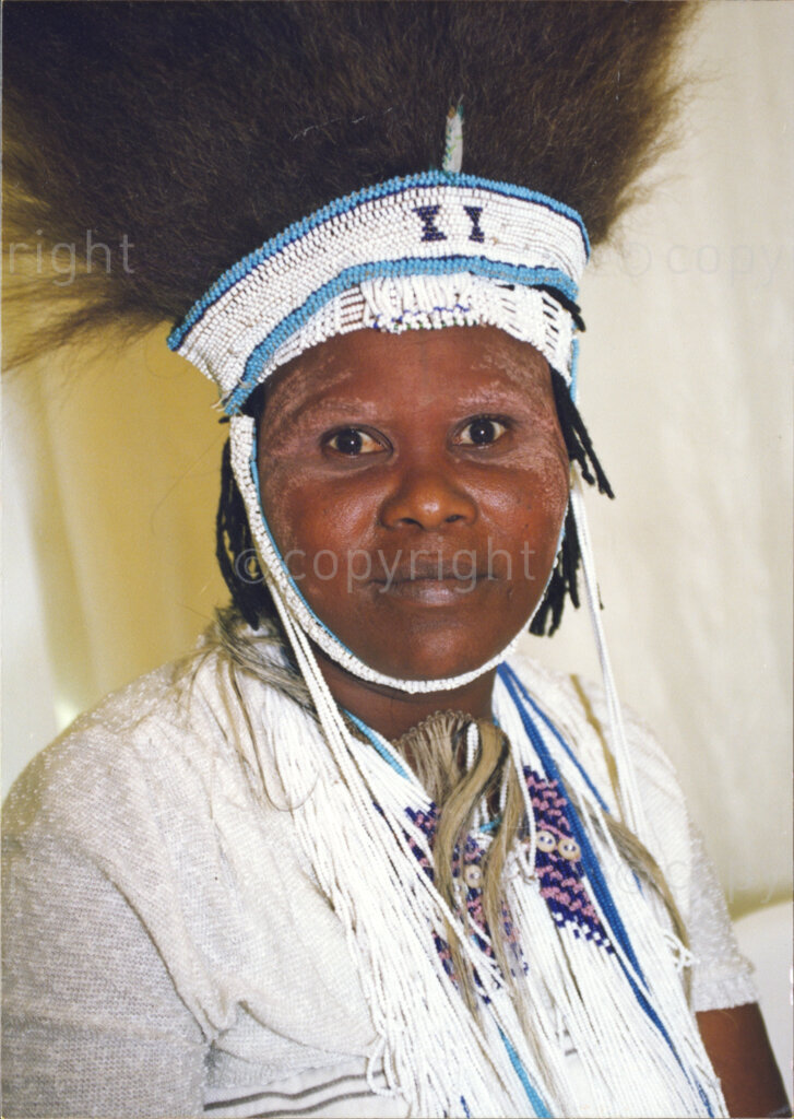 Cape Town, Western Cape, South Africa, 19970418. PHOTO: ANC Archives.

A portrait of a woman in traditional Xhosa dress and wearing Xhosa beadwork and headdress of feathers at the inauguration of the National Council of Traditional Leaders in Cape Town, Western Cape, South Africa on 18 April 1997.