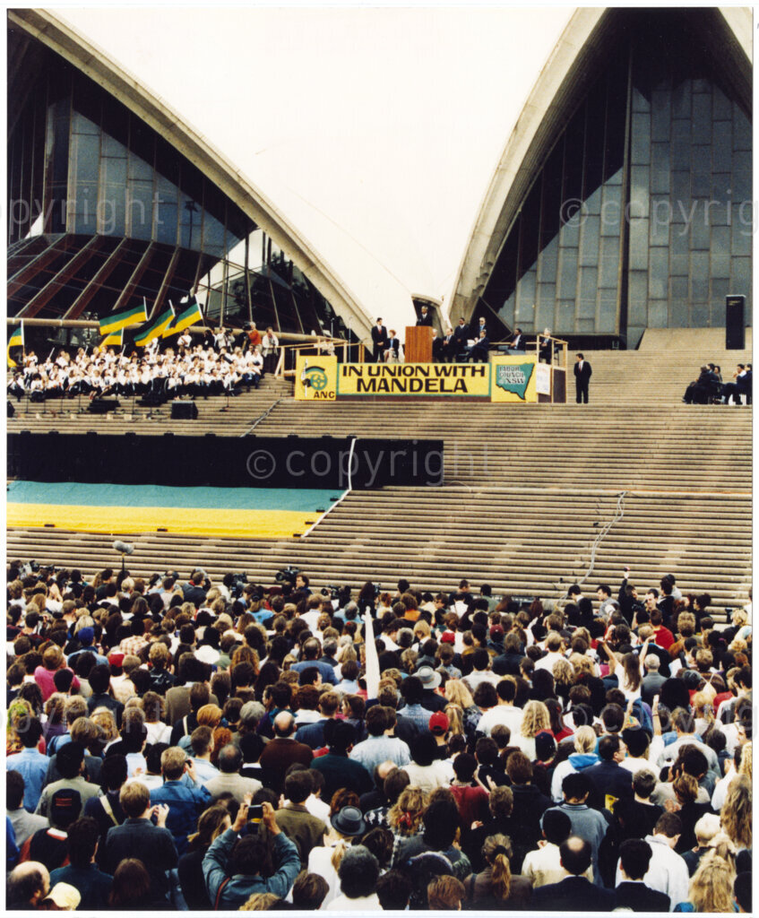 Australia, October 1990. PHOTO: ANC Archives: Nelson Mandela, Deputy President of the African National Congress, addresses an audience of thirty thousand Australian citizens in 1990, within months of his release from a 27 year prison sentence. He thanks the Australians for the pressure they brought to bear on the apartheid government in South Africa. He attributes his release to the economic and political pressure by parties such as the Australian Labour Party. Monday 22 October to Saturday 27 October 1990.
