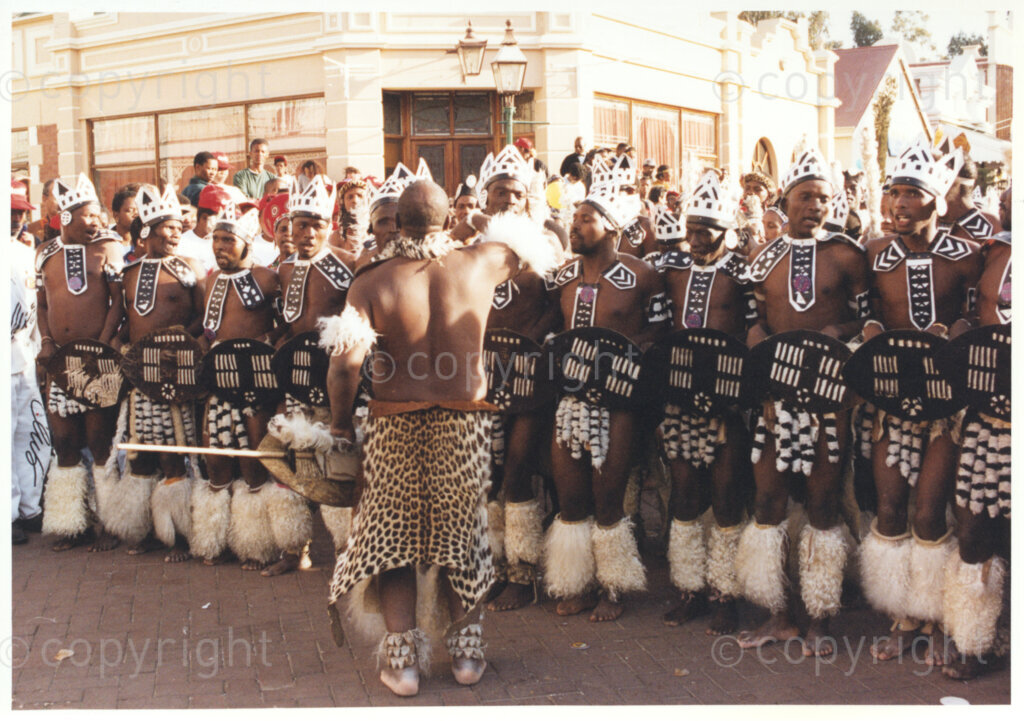 Gold Reef City, Johannesburg, Gauteng, South Africa, 19950717. PHOTO: ANC Archives.

A group of Zulu dancers dressed in traditional attire entertain the guests as they await the arrival of the President of South Africa, Nelson Mandela, at his 77th birthday celebration at Gold Reef City, Johannesburg, on Monday the 17th July 1995. More than 2,000 underprivileged children, including 34 children who are currently imprisoned, street children, children from orphanages, mentally disabled children and children who have been abused, have been invited to attend his birthday celebration with him. Madiba is attending this function in his personal capacity as he places special emphasis on the plight of children. A variety of entertainments have been put on for the children.