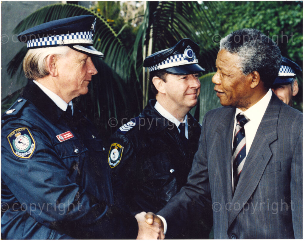 Australia, October 1990. PHOTO: ANC Archives: Greeting police officers, on his 1990 trip to Australia, Nelson Mandela, Deputy President of the African National Congress, takes every opportunity to communicate with Australians who supported him and the ANC during his 27 year incarceration.  Monday 22 October to Saturday 27 October 1990.