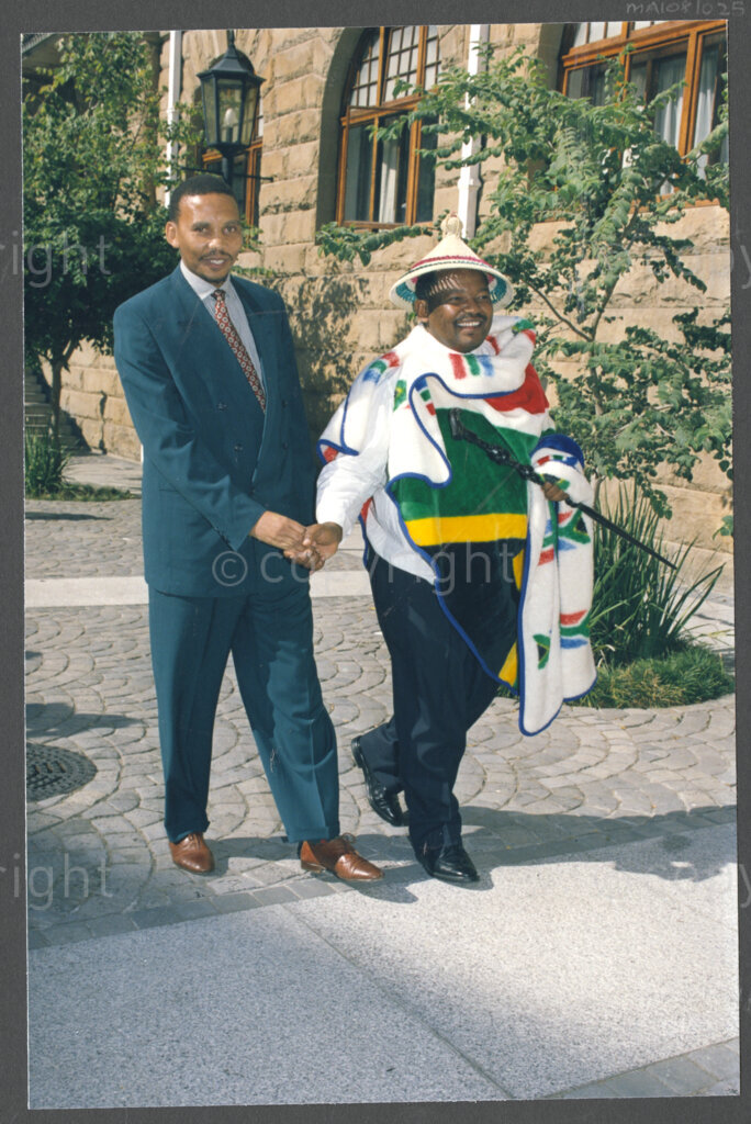 Cape Town, Western Cape, South Africa, 19970418. PHOTO: ANC Archives.

An unidentified man wearing a black suit (left) and Mosiuoa Patrick Lekota in traditional Basotho dress (right) walk together at the inauguration of the National Council of Traditional Leaders in Cape Town, Western Cape, South Africa on 18 April 1997.
