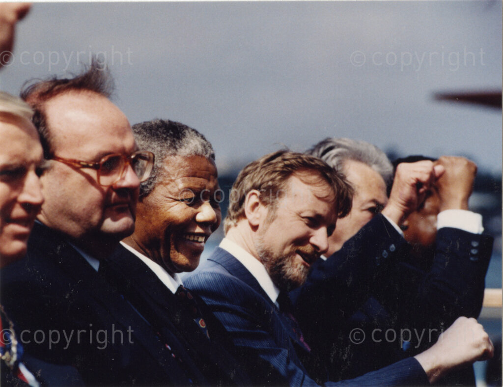 Australia, October 1990. PHOTO: ANC Archives: 
Nelson Mandela, Deputy President of the African National Congress, (centre), meets with Australian policy-makers, diplomats and politicians during his goodwill visit to Australia, in 1990. He expresses his gratitude for the activist support and economic pressures exerted by this country on the failing apartheid regime of South Africa. Monday 22 October to Saturday 27 October 1990.