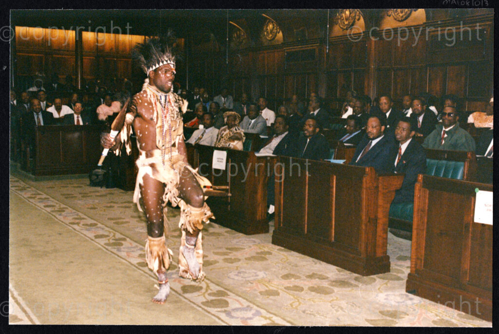 National Assembly, Parliament, Cape Town, Western Cape, South Africa, 19970418. PHOTO: Pan African Archives.

A Zulu man in full traditional dress, holding a spear and shield in the aisle of the National Assembly, Parliament, Cape Town at the inauguration of the National Council of Traditional Leaders on 18 April 1997.