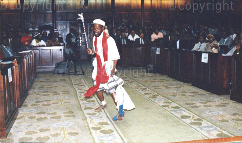 National Assembly, Parliament, Cape Town, Western Cape, South Africa , 19970418. PHOTO: ANC Archives.

A man dressed in traditional Xhosa dress performs a traditional Xhosa dance (Umxhentso) with a stick in the National Assembly, Parliament at the inauguration of the National Council of Traditional Leaders in Cape Town, Western Cape, South Africa on 18 April 1997.