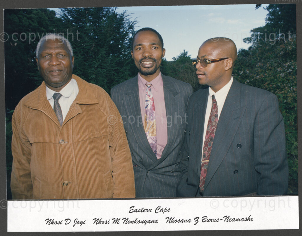 Cape Town, Western Cape, South Africa, 19970418. PHOTO: ANC Archives.

A group portrait of, from left, Nkosi D. Joyi, Nkosi M. Nonkonyana, and Nkosana Z. Burns-Ncamashe from the Eastern Cape at the social function following the inauguration of the National Council of Traditional Leaders in Cape Town, Western Cape, South Africa on 18 April 1997.