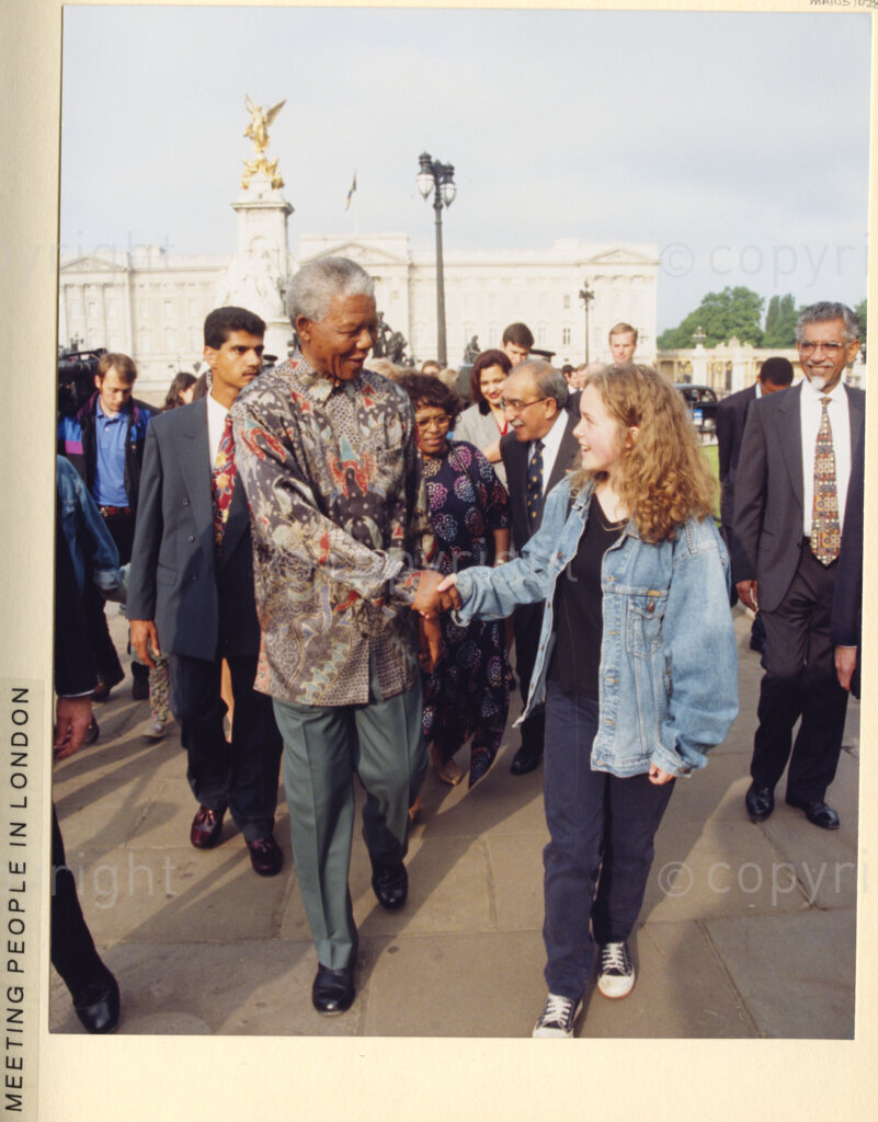 London, United Kingdom, 19960701. PHOTO: ANC Archives: During President Nelson Mandela's July 1996 state visit to the United Kingdom, (UK), crowds of admirers crammed the streets of London, to get a glimpse of the iconic South African philanthropist. Mandela, touched by their fervour, was warmly responsive.