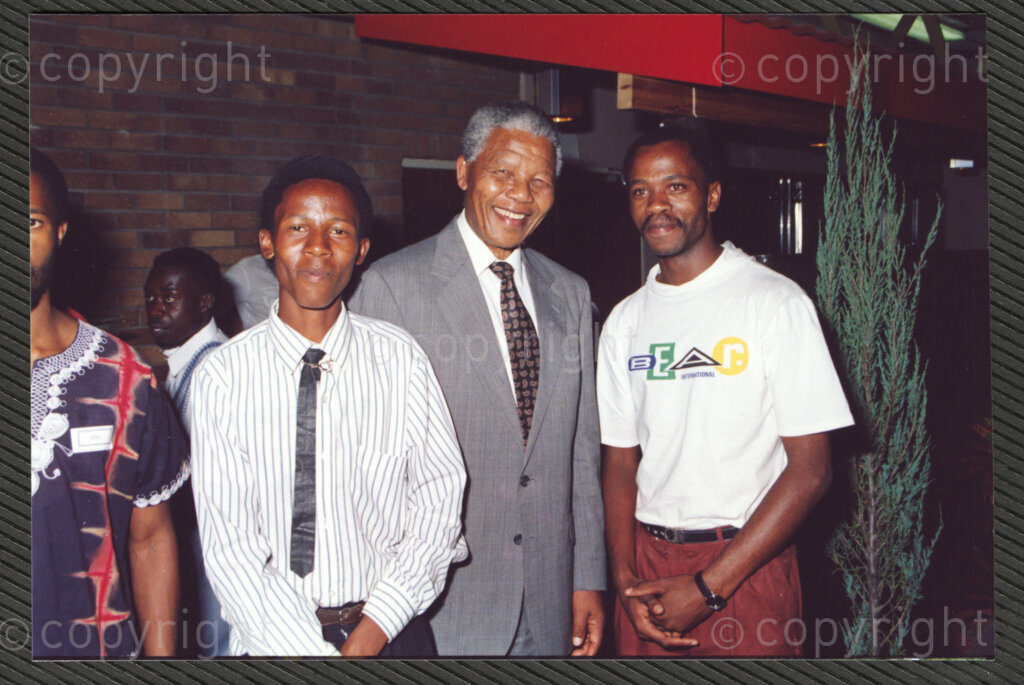 Turfloop Campus, University of the North, Mankweng, Northern Transvaal, South Africa, 19920424. PHOTO: ANC Archives.

Nelson Mandela, the president of the African National Congress (ANC) (second left), smiles broadly as he interacts with a group of guests at a celebratory function after the naming ceremony of the Oscar Mpetha Stadium and the student halls of residence at the Turfloop Campus of the University of the North (now the University of Limpopo), Mankweng, Northern Transvaal (now Limpopo), South Africa, 24 April 1992.