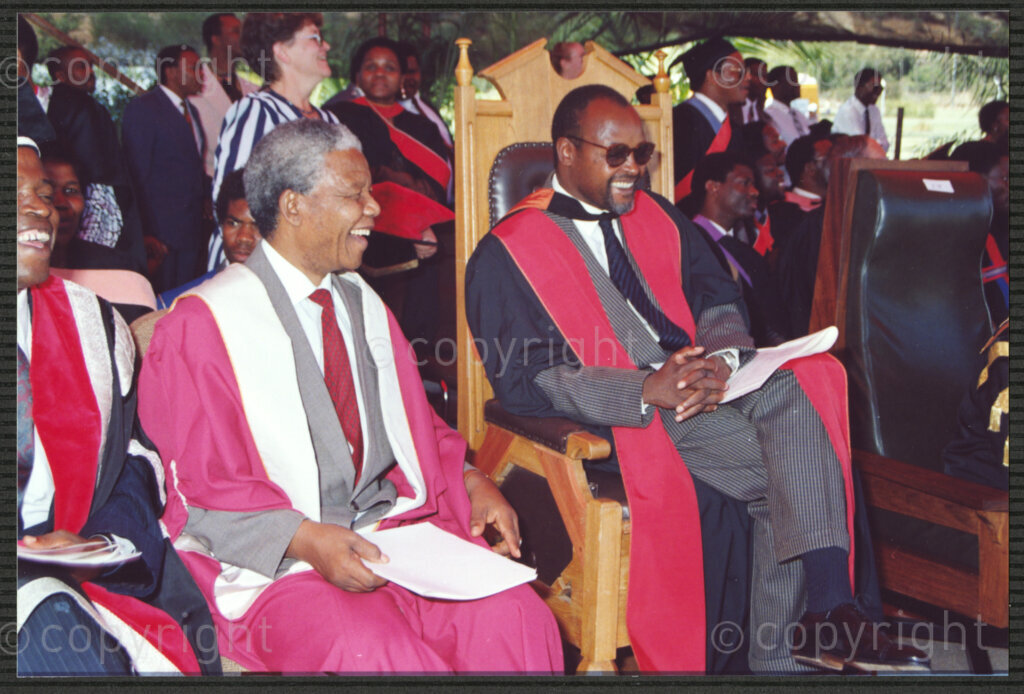 Turfloop Campus, University of the North, Mankweng, Northern Transvaal, South Africa, 19920425. PHOTO: ANC Archives.

Nelson Mandela, the president of the African National Congress (ANC)(centre), smiles broadly during the ceremony that sees him and Professor Noel Chabani Manganyi (right) installed as chancellor and vice chancellor of the University of the North respectively (now the University of Limpopo), 25 April 1992, Turfloop Campus, University of the North, Mankweng, Northern Transvaal (now Limpopo), South Africa.