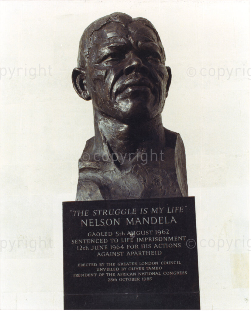 Haringey , London, England, United Kingdom, Date Unknown. PHOTO: ANC Archives.

A bronze bust of Nelson Mandela by sculptor and socialist, Ian Walters. The inscription on the plaque reads, Gaoled 5 August 1962. Sentenced to life imprisonment on 12 June 1964 for his actions against apartheid. Erected by the Greater London Council (GLC). Unveiled by Oliver Tambo, President of the ANC 28 October 1985. The bust is situated on the South bank of the Royal Festival Hall in London. Height of bust is 1.52m, size of marble plinth 2.11m (h) x 1.02m(w) x 0,97m(d)