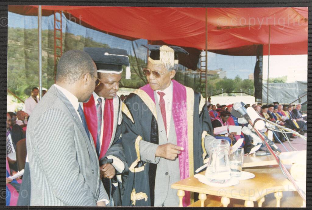 Turfloop Campus, University of the North, Mankweng, Northern Transvaal, South Africa, 19920425. PHOTO: ANC Archives.

Nelson Mandela, the president of the African National Congress (ANC) (right), and Professor Noel Chabani Manganyi (left) stand on either side of Deputy Vice Chancellor John Malatji, during the ceremony that sees Mandela and Manganyi installed as chancellor and vice chancellor of the University of the North respectively (now the University of Limpopo), 25 April 1992, Turfloop Campus, University of the North (University of Limpopo) Mankweng, Northern Transvaal (now Limpopo), South Africa.