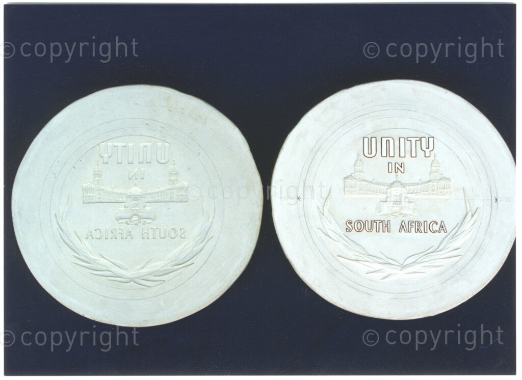 South African Mint, Johannesburg, Gauteng, South Africa, 19950919. PHOTO: ANC Archives.

A Nelson R. Mandela Presidential Medallion collection is being minted by the South African Mint in 1995, to commemorate the inauguration of the country's first democratically elected president in 1994. The collection has been commissioned by Education Africa; the proceeds from the sale of medallions in the collection are going towards the funding of education projects in South Africa. Seen here are plaster of Paris models of the positive and negative imprints of a medallion Reverse (designed by Susan Erasmus).