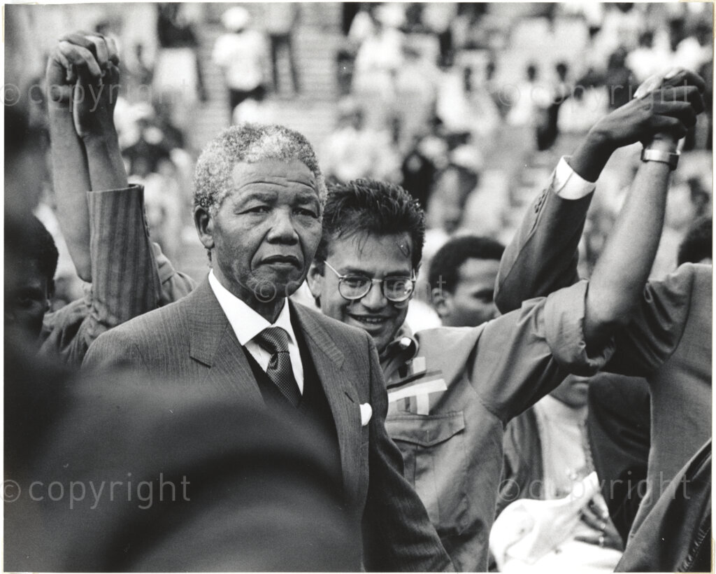 Protection, Mr Mandela arrives at the Welcome Home rally.