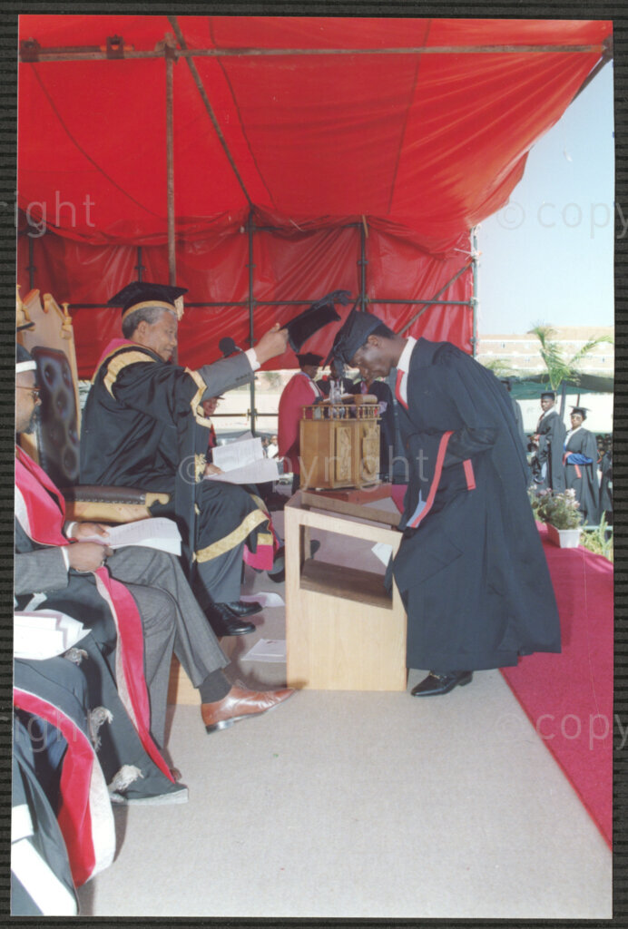 Turfloop Campus, University of the North, Mankweng, Northern Transvaal, South Africa, 19920425. PHOTO: ANC Archives.

Acting in his new position as the chancellor of the University of the North, Nelson Mandela, the president of the African National Congress (ANC), caps a student during the university's graduation ceremony on the Turfloop campus, University of the North (now the University of Limpopo), Mankweng, Northern Transvaal (now Limpopo), South Africa, 25 April 1992. Professor Noel Chabani Manganyi, the newly appointed vice chancellor of the University of the North (left), looks on. Both Mandela and Manganyi are dressed in full academic regalia.