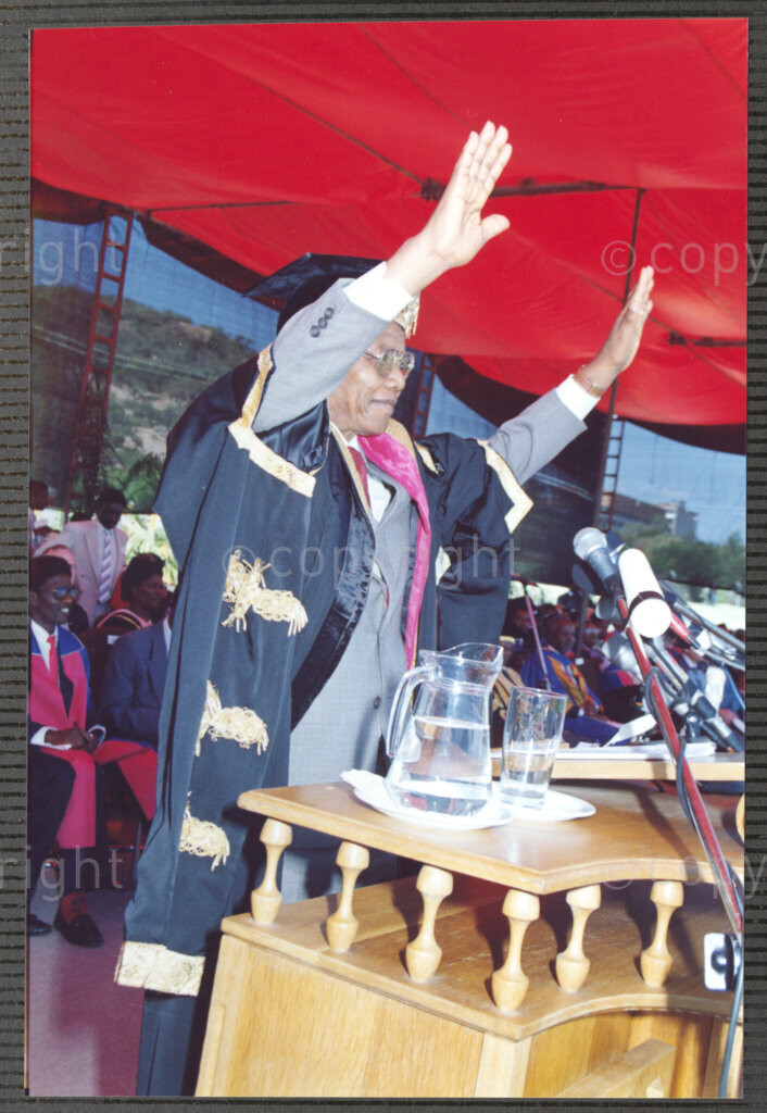 Turfloop Campus, University of the North, Mankweng, Northern Transvaal, South Africa, 19920425. PHOTO: ANC Archives.

Nelson Mandela, the president of the African National Congress (ANC), greets the audience by raising his hands at the ceremony that sees him and Professor Noel Chabani Manganyi installed as chancellor and vice chancellor of the University of the North respectively, 25 April 1992, Turfloop Campus, University of the North (now the University of Limpopo), Mankweng, Northern Transvaal (now Limpopo), South Africa.