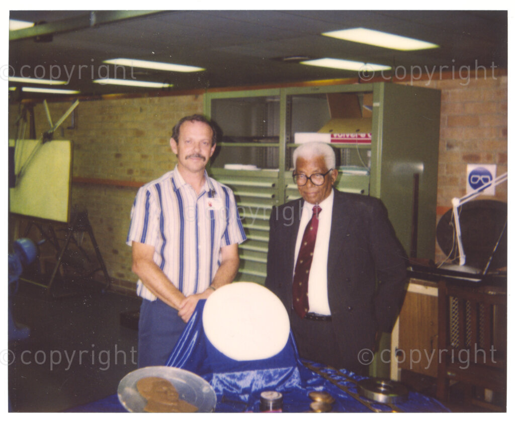 South African Mint, Johannesburg, Gauteng, South Africa, 19950919. PHOTO: ANC Archives.

Walter Sisulu (right) inspects the Nelson R. Mandela Presidential Medallion collection. The collection is being minted by the South African Mint in 1995, to commemorate the inauguration of the country's first democratically elected president in 1994. The collection is being minted for Education Africa; the proceeds from the sale of medallions in the collection are going towards the funding of education projects in South Africa. The designers of the collection are Arthur Sutherland (Obverse) and Susan Erasmus (Reverse).