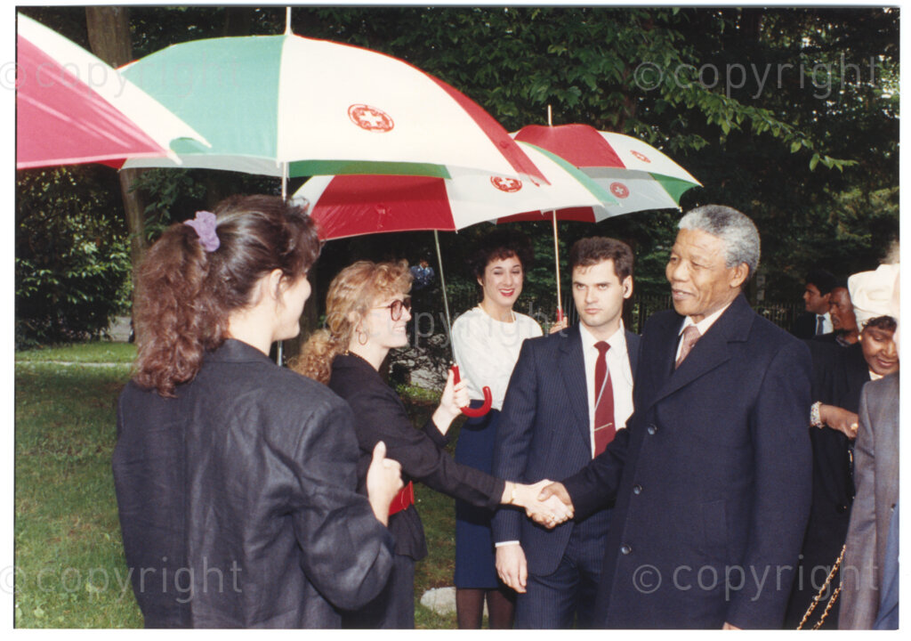 International Reformed Centre John Knox, Geneva, Switzerland, 19900609. PHOTO: ANC Archives.

Recently appointed Deputy President of the African National Congress (ANC) Nelson Mandela (second left) greets an unidentified group of men and women at the International Reformed Centre John Knox (IRCJK), Geneva, Switzerland, 1990 during Nelson Mandela Mandela's official visit to Switzerland, 4-9 June 1990. Winnie Madikizela-Mandela is standing slightly behind Nelson Mandela (right).