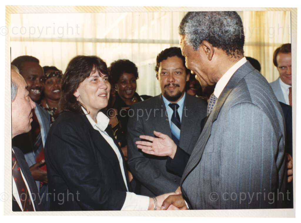 Geneva Ecumenical Centre, Geneva, Switzerland, 19900601. PHOTO: ANC Archives.

Recently appointed Deputy President of the African National Congress (ANC) Nelson Mandela greets Jean Stromberg the executive secretary for Secretary General of the World Council of Churches (WCC) Emilio Castro at the Geneva Ecumenical Centre, Switzerland at the time of the Mandela couples visit to staff, officials and representatives of the WCC during Nelson Mandela's official visit to Switzerland 4-9 June 1990.