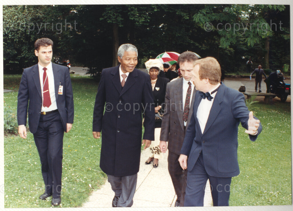 Geneva Ecumenical Centre, Geneva, Switzerland, 19900601. PHOTO: ANC Archives.

Norwegian priest and organizational leader Trond Bakkevig (front) addresses Winnie Madikizela Mandela (third right) and recently elected Deputy President of the African National Congress ((ANC) Nelson Mandela (fourth right) in the gardens of the Geneva Ecumenical Centre, Switzerland when the Mandela couple visit staff, officials and representatives of the WCC during Nelson Mandela's official visit to Switzerland, 4-9 June 1990.