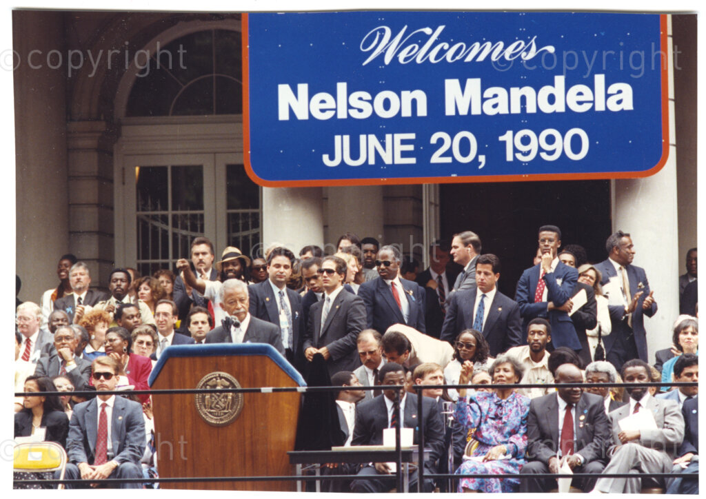 New York City Hall, New York, New York State, United States of America, 19900620. PHOTO: ANC Archives.

In 1990, Nelson Mandela and his wife, Winnie Mandela, visit the city of New York from 20 to 23 June. This is the start of a 14-nations Freedom Tour, just 4 months after Mandela's release from jail. His host, Mayor David Dinkins, introduces Mandela to throngs of supporters outside New York City Hall. The welcome Mandela receives from thousands of people is rapturous.
