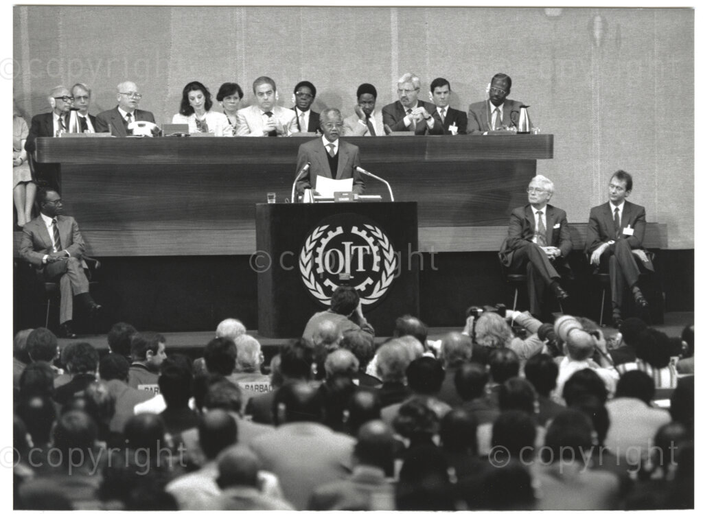 International Labour Organisation , Geneva, Switzerland, 19900608. PHOTO: ANC Archives.

The auditorium at the International Labour Organisation (ILO) in Geneva, 8 June 1990 is filled to capacity on the occasion of the 77th Session of the International Labour Conference (ILC) that played host to the deputy president of the African National Congress (ANC) Nelson Mandela. The ILO brings governments, employers and workers of approximately 187 member states together to set labour standards, develop policies and devise programmes promoting decent work for all women and men.