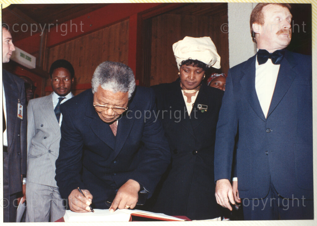 International Reformed Centre John Knox , Geneva, Switzerland, 19900609. PHOTO: ANC Archives.

Reverend Jean-Jacques Bauswein Director of the International Reformed Centre John Knox (IRCJK), Winnie Madikizela-Mandela and recently elected Deputy President of the African National Congress (ANC) Nelson Mandela signing what could possibly be the visitors book at the International Reformed Centre John Knox, Geneva, Switzerland, 9 June 1990 during Nelson Mandela's official visit to Switzerland, 4-9 June 1990.