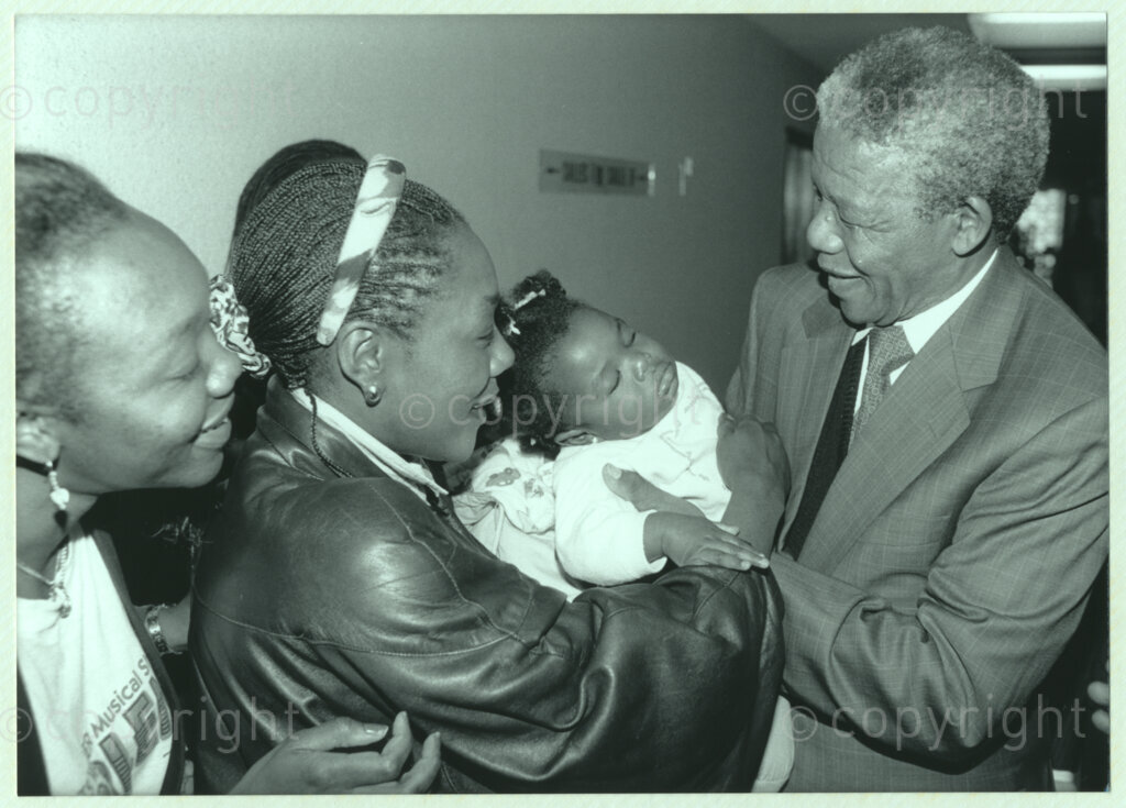 International Reformed Centre John Knox, Geneva, Switzerland, 19900609. PHOTO: ANC Archives.

Recently appointed Deputy President of the African National Congress (ANC) Nelson Mandela reaches out to pick up an infant being held by its mother at the International Reformed Centre John Knox (IRCJK), Geneva, Switzerland, 1990 during Nelson Mandela Mandela's official visit to Switzerland, 4-9 June 1990.