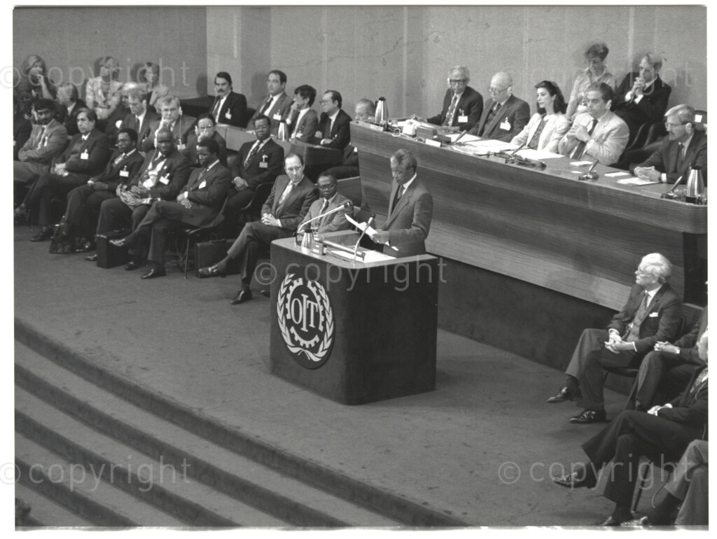 International Labour Organisation , Geneva, Switzerland, 19900608. PHOTO: ANC Archives.

The auditorium at the International Labour Organisation (ILO) in Geneva, 8 June 1990 is filled to capacity on the occasion of the 77th Session of the International Labour Conference (ILC) that played host to the deputy president of the African National Congress (ANC) Nelson Mandela. The ILO brings governments, employers and workers of approximately 187 member states together to set labour standards, develop policies and devise programmes promoting decent work for all women and men.