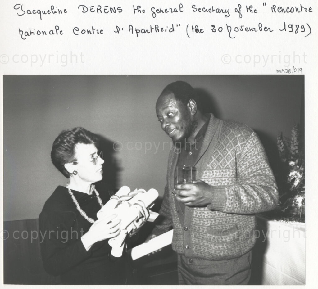 Arcueil, Val-de-Marne, Paris, Île-de-France, France, 19891130. PHOTO: ANC Archives: African National Congress comrades living in exile and members of various French anti-apartheid movements (including Jacqueline Derens, general secretary of National Gathering against Apartheid (RNCA) (right)) gather in Arcueil, France on 30 November 1989 for the unveiling of a commemorative plaque for Dulcie September. Dulcie September, a South African anti-apartheid activist and ANC Chief Representative in France, Switzerland and Luxembourg, was assassinated outside the ANC's Paris office at 28 Rue des Petites-Ecuries last year on 29 March 1988.