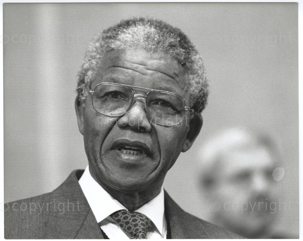 International Labour Organisation , Geneva, Switzerland, 19900608. PHOTO: ANC Archives.

A photographic portrait of Deputy President of the African National Congress (ANC) Nelson Mandela during his visit to Switzerland with his spouse Winnie Madikizela-Mandela from 4-9 June 1990 barely four months after his release from 27 years in prison. On 8 June 1990 he addresses the 77th Session of the International Labour Conference (ILC) at the International Labour Organisation (ILO) in Geneva where he expresses his gratitude for the support received from the ILO and urges the international community to persist in their demands that all political prisoners must be released, political trials ended, exiles returned, repressive legislation repealed, and the state of emergency ended in its entirety.