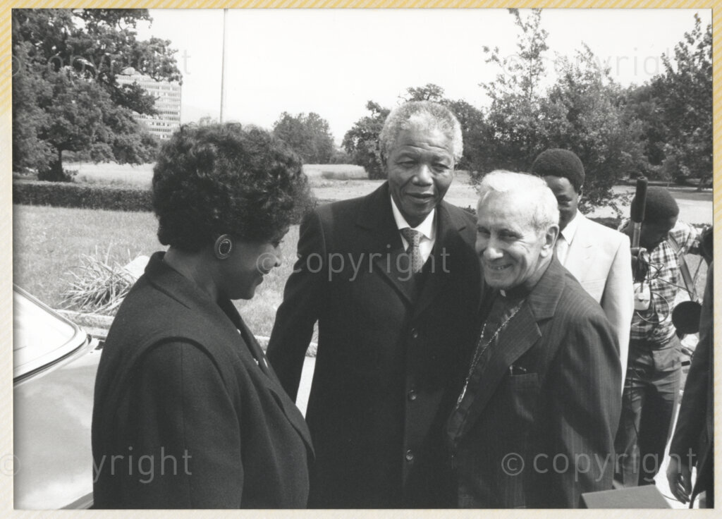 Geneva Ecumenical Centre, Geneva, Switzerland, 19900601. PHOTO: ANC Archives.

Winnie Madikizela- Mandela (left to right), recently elected Deputy President of the African National Congress (ANC) Nelson Mandela and Secretary General of the World Council of Churches Emilio Castro upon the arrival of the Mandela's couples visit to the Geneva Ecumenical Centre, Switzerland when the Mandela couple visit staff, officials and representatives of the (WCC) during Nelson Mandela's official visit to Switzerland, 4-9 June 1990. During the visit, barely a few months after his release from prison, Nelson Mandela expresses his gratitude to the church for its support of the anti-apartheid struggle.