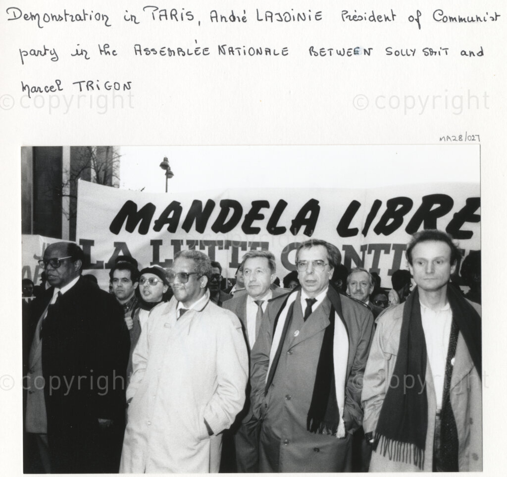 Arcueil, Val-de-Marne, Paris, Île-de-France, France, 19891130. PHOTO: ANC Archives: African National Congress comrades join Andre Lajoinie, president of the Communist caucus of the French National Assembly and member of the French Communist Party (PCF) (third right), and Mayor of Arcueil (Val-de-Marne) and figure of communism, Marcel Trigon (second right) at an anti-apartheid demonstration in Arcueil, France on 30 November 1989 to call for the release of Nelson Mandela.