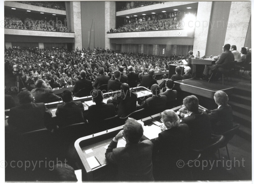 International Labour Organisation , Geneva, Switzerland, 19900608. PHOTO: ANC Archives.

The auditorium at the International Labour Organisation (ILO) in Geneva, 8 June 1990 is filled to capacity on the occasion of the 77th Session of the International Labour Conference (ILC) that played host to Deputy President of the African National Congress (ANC) Nelson Mandela. The ILO brings governments, employers and workers of approximately 187 member states together to set labour standards, develop policies and devise programmes promoting decent work for all women and men.