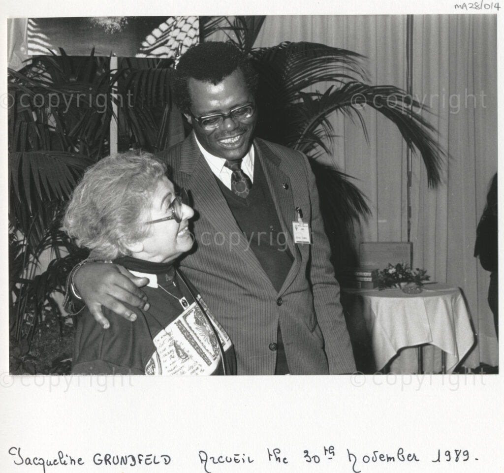 Arcueil, Val-de-Marne, Paris, Île-de-France, France, 19891130. PHOTO: ANC Archives: An African National Congress comrade embraces Jacqueline Grunfeld, vice president of the solidarity group National Gathering against Apartheid (RNCA) (and who was a personal friend of Dulcie September) (left) at a gathering in Arcueil, France on 30 November 1989 held to unveil a commemorative plaque for Dulcie September. Dulcie September, a South African anti-apartheid activist and ANC Chief Representative in France, Switzerland and Luxembourg, was assassinated outside the ANC's Paris office at 28 Rue des Petites-Ecuries last year on 29 March 1988.
