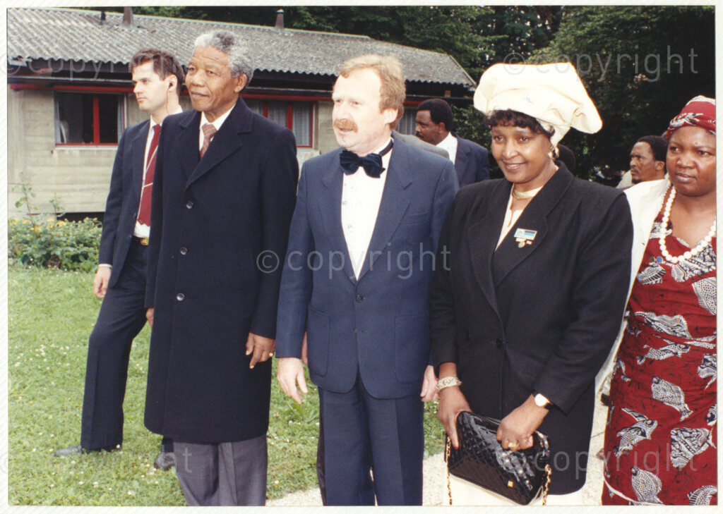 John Knox International Reform Centre, Geneva, Switzerland, 19900609. PHOTO: ANC Archives.

Mary Balikungeri (right to left) founder member of the Rwanda Women's network, Winnie Madikizela-Mandela, author Jean-Jacques Bauswein and recently elected Deputy President of the African National Congress (ANC) Nelson Mandela in the gardens of John Knox International Reform Centre, Geneva, 9 June 1990 during Nelson Mandela's official visit to Switzerland, 4-9 June 1990.