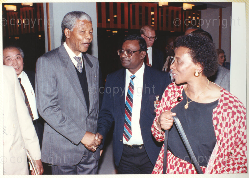 Geneva Ecumenical Centre, Geneva, Switzerland, 19900601. PHOTO: ANC Archives.

A few months after his release from prison, newly elected Deputy President of the African National Congress (ANC) Nelson Mandela and his wife, Winnie Madikizela-Mandela make an official visit to Switzerland, 4-9 June 1990. Shortly after his arrival in Geneva, he visits the Geneva Ecumenical Centre. At the reception, Nelson Mandela (second left) greets co-director of the Division of Mission and Evangelism, South African Council of Churches (SACC) Reverend Sol Jacobs (centre). During this visit, Nelson Mandela expresses his gratitude to the church for its support of the anti-apartheid struggle and urged them to continue with their efforts.