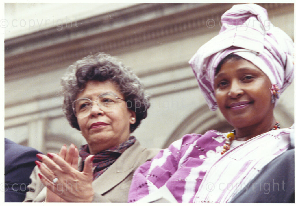 New York, New York State, United States of America, 19900601. PHOTO: ANC Archives.

In 1990, Nelson Mandela and his wife, Winnie Mandela, visit the city of New York from 20 to 23 June. This is the start of a 14 nations Freedom Tour, just 4 months after Mandela's release from jail. Winnie, accompanied by Joyce Dinkins looks elegant and mature in a traditional African outfit.