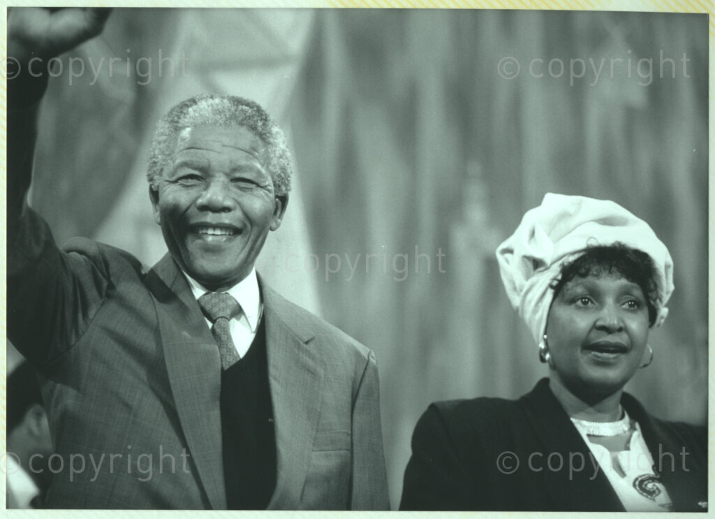 International Reformed Centre John Knox, Geneva, Switzerland, 19900609. PHOTO: ANC Archives.

A close-up photograph of recently elected Deputy President of the African National Congress (ANC) Nelson Mandela and Winnie Madikizela-Mandela (right) at the International Reformed Centre John Knox, (IRCJK)Geneva, 9 June 1990 during Nelson Mandela's official visit to Switzerland, 4-9 June 1990.