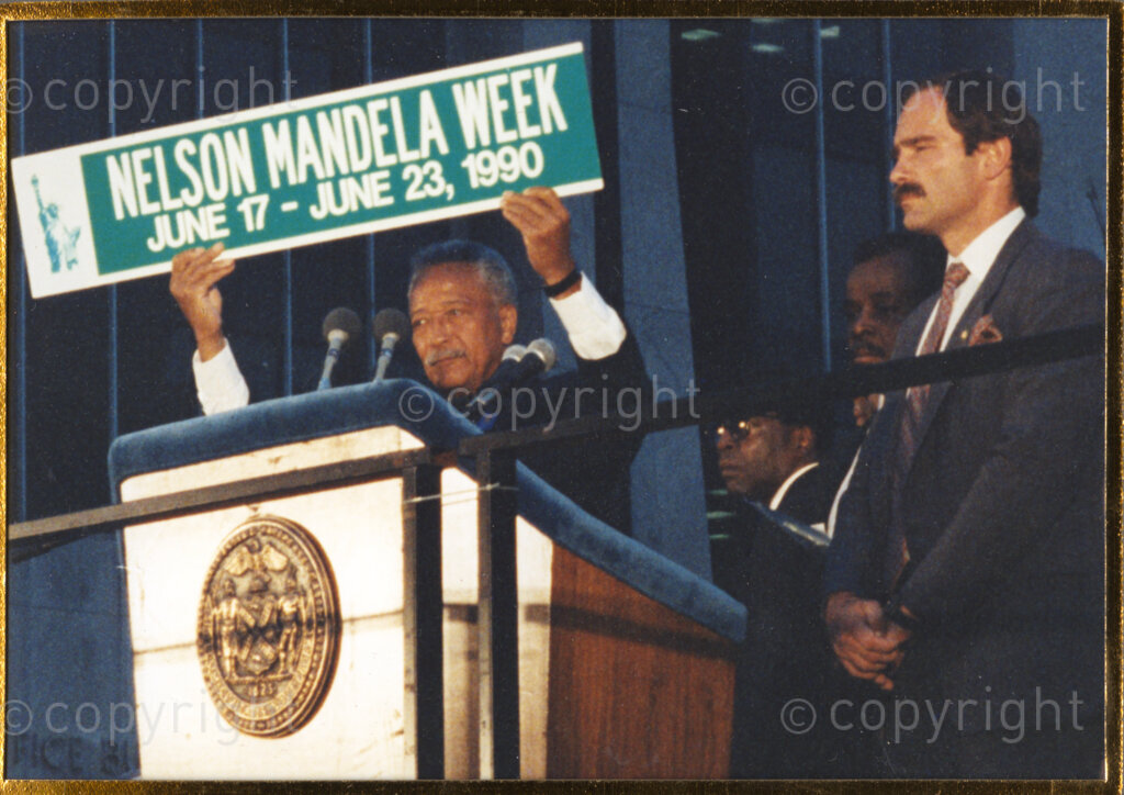 New York, New York State, United States of America 19900620. PHOTO: ANC Archives.

Nelson Mandela and his wife, Winnie, are on a 14-nation Freedom Tour in June 1990, just four months after his release from prison. In New York, the United States of America, Mayor David Dinkins holds aloft a banner proclaiming 'Nelson Mandela Week, June 17 - June 23, 1990.' Dinkins and his wife, Joyce, are the Mandela's hosts. Dinkins is the first black mayor of New York City.