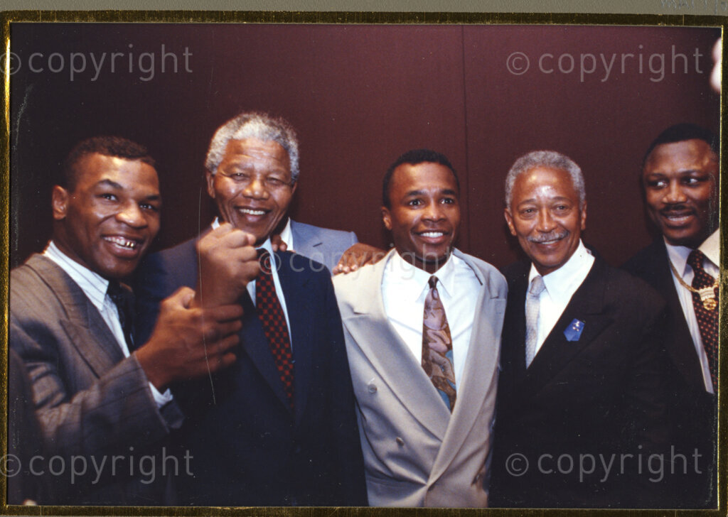 New York, New York State, United States of America, 19900601. PHOTO: ANC Archives.

In 1990, Nelson Mandela and his wife, Winnie Mandela, visit the city of New York from 20 to 23 June. This is the start of a 14-nations Freedom Tour, just 4 months after Mandela's release from jail. Mandela, (second from the left), shows he still has what it takes to make a fist, and to take on the fight for freedom. His host, New York Mayor, David Dinkins is second from the right. The two men are surrounded by keen supporters who are unidentified.
