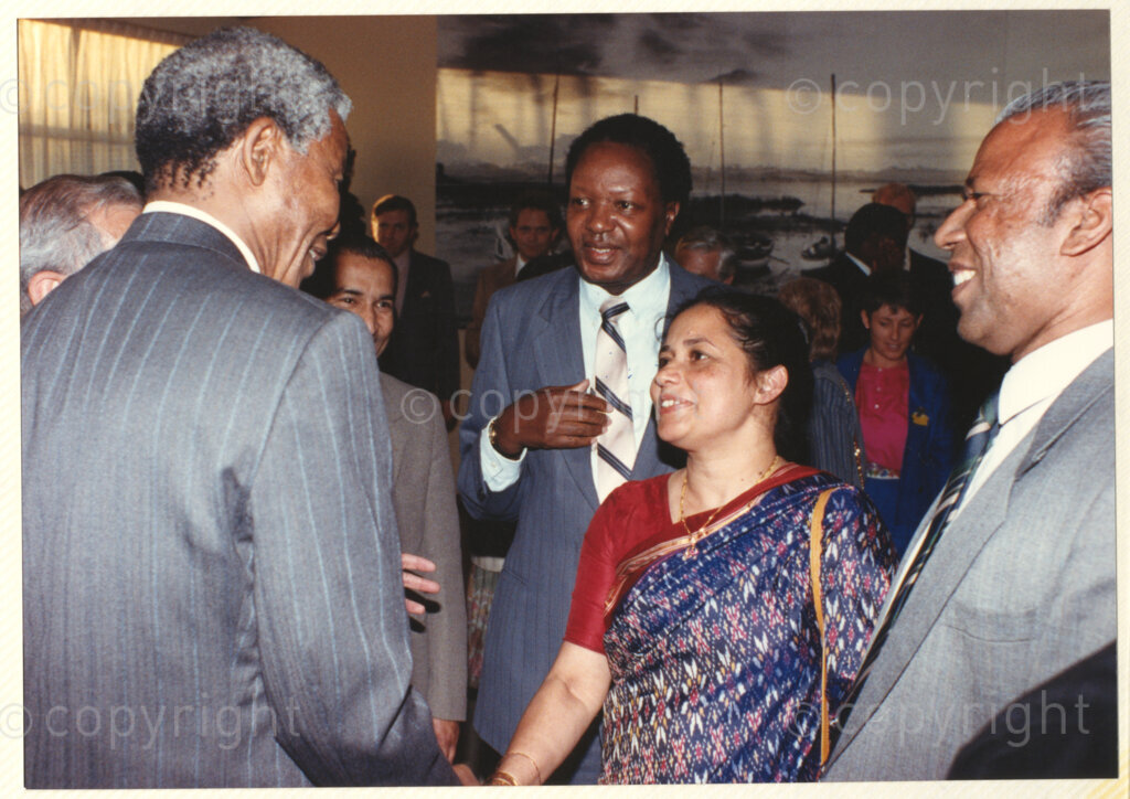 Geneva Ecumenical Centre, Geneva, Switzerland, 19900601. PHOTO: ANC Archives.

A few months after his release from prison, newly elected Deputy President of the African National Congress (ANC) Nelson Mandela and his wife, Winnie Madikizela-Mandela make an official visit to Switzerland, 4-9 June 1990. Shortly after his arrival in Geneva, he visits officials and staff members of the World Council of Churches (WCC) and other organisations. Amongst the guests Nelson Mandela meets Director of the Commission of the Churches on International Affairs (CCIA) Dr Ninan Koshy (right) and his wife Susan Koshy (centre) wearing a traditional Indian saree. During this visit, Nelson Mandela expresses his gratitude to the church for its support of the anti-apartheid struggle.