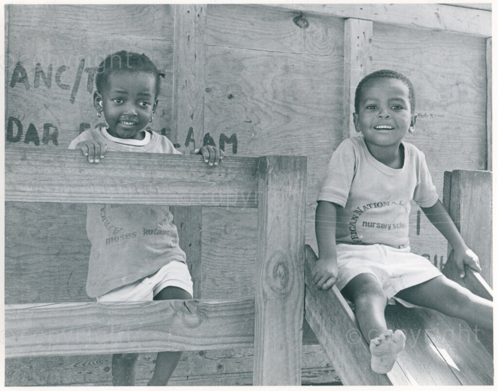 Nursery school kids in the play house outside the school in Mazimbu, Tanzania, November 1983. Photo: Eli Weinberg Photo Lab.