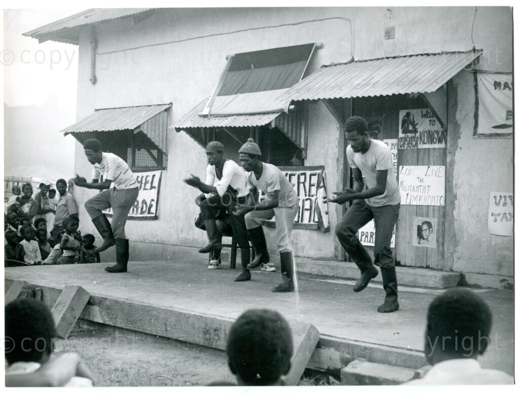 Meeting to commemorate Heroes Day in the ANC settlement of Mazimbu in Tanzania, 16 December 1979: students dancing the Gumboot Dance. Photo: Eli Weinberg Photo Lab.