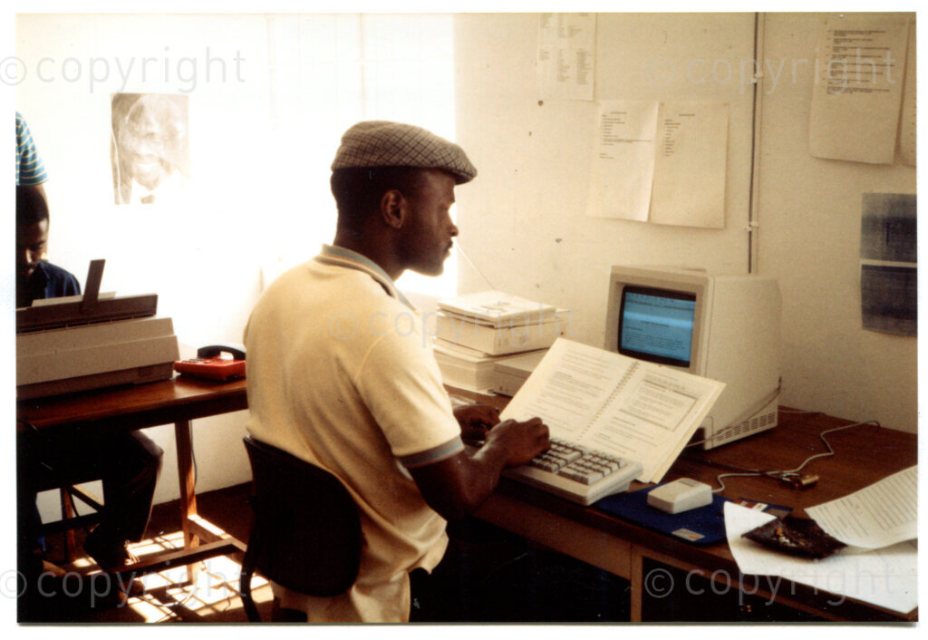 The office of the ANC's Department of Arts and Culture in Lusaka, with the recently installed computer equipment; October 1988. Photographer: being Muller.