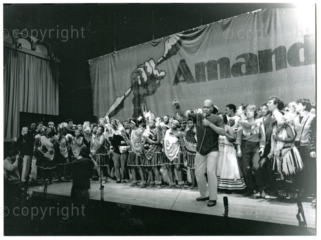 Performance by ANC cultural ensemble AMANDLA, James Phillips and Dutch choirs in the Royal Tropical Museum in Amsterdam, The Netherlands, 16 December 1983. Photographer: Inge Goijaerts.
