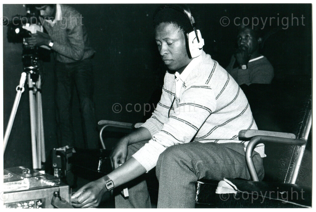 Radio Freedom worker David Pule making a radio recording in Lusaka, Zambia; June 1986. Photographer: Inge Goijaerts.