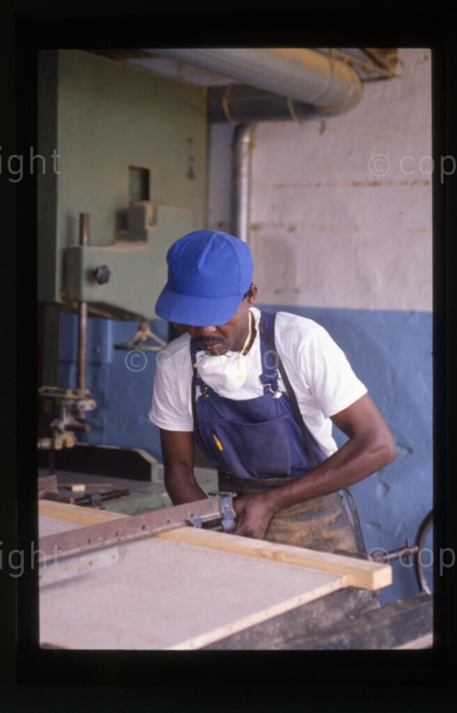 Furniture factory, including students being shown around by factory official, Mazimbu (SOMAFCO), Tanzania, 1990