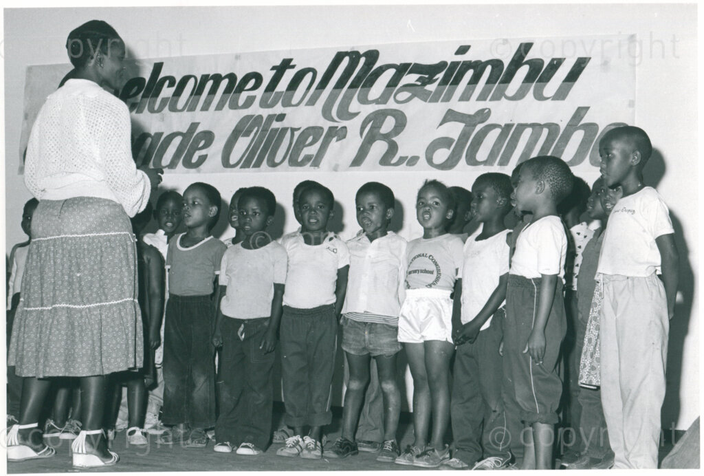 Children's choir of the nursery school welcome ANC president Oliver Tambo in Mazimbu, Tanzania, September 1984. Photo: Eli Weinberg Photo Lab.