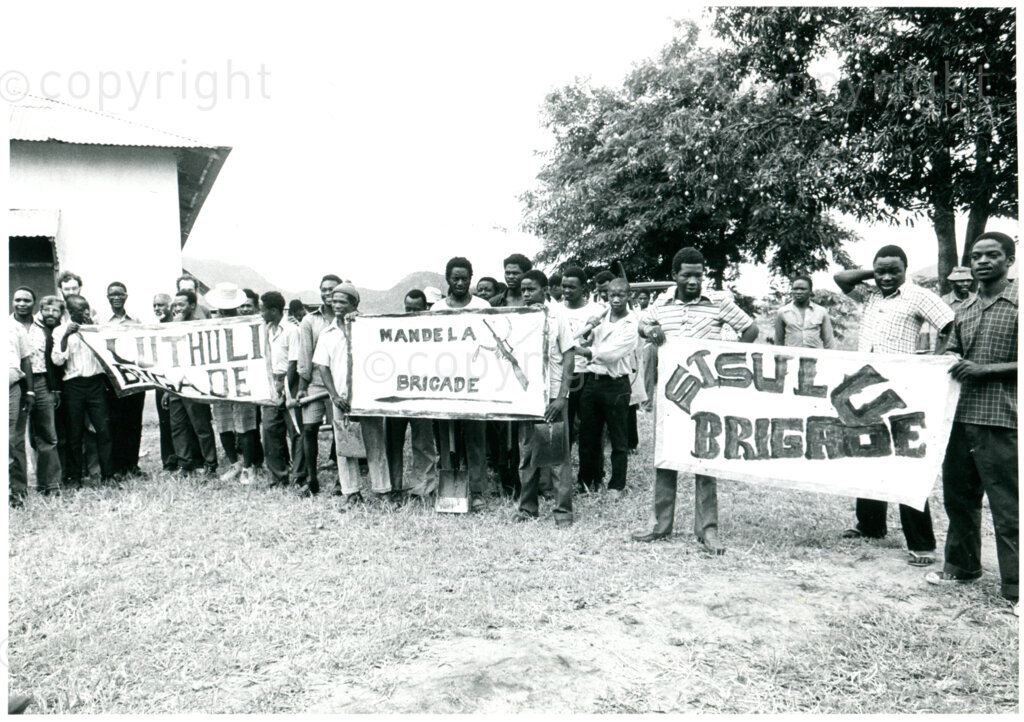 The Mandela, Sisulu and other Brigades  brigades perform specific work duties on special days in Mazimbu, Tanzania, Fall 1979. Photographer: Eli Weinberg.